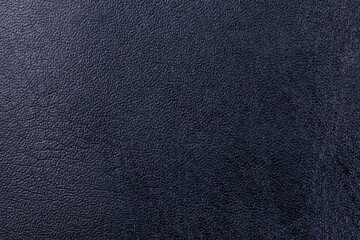 A close up of a black leather surface