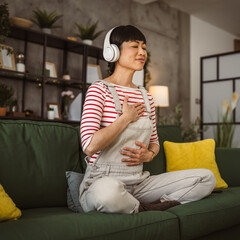 Mature japanese woman practice guided meditation manifestation at home