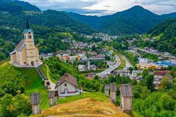 Fototapeta na wymiar Church of Saint Anthony and panorama of Slovenian town Idrija