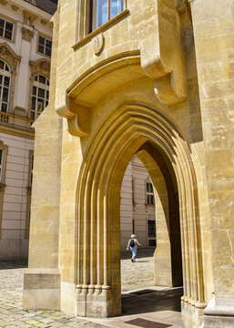Solo Traveler through Arch in Vienna Austria