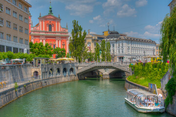 Franciscan Church of the Annunciation ant the riverside of Ljubl