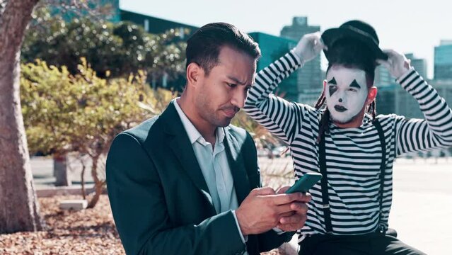 Businessmen, smartphone and typing with street mime in downtown to search location or navigate New York. Entrepreneur, cellphone and irritated with internet browse or online conversation and mimic