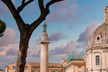 Historic European city scene featuring a large dome, ancient victory column with statue, leafy...