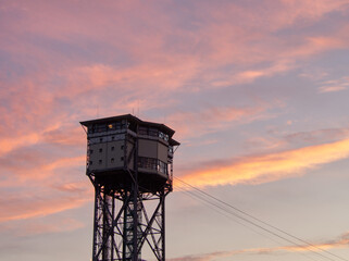 Barcelona, Spain - February 29, 2024: Torre Sant Sebastia in sunset colors. 