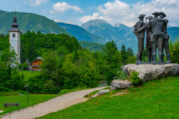 Monument to four brave men at lake Bohinj in Slovenia - obrazy, fototapety, plakaty