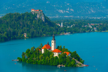 Assumption of Maria church and Bled Castle at lake Bled in Slove - obrazy, fototapety, plakaty