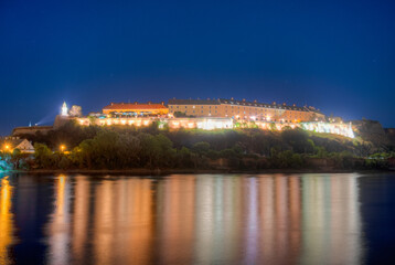 Night view of Petrovaradin fortress in Serbian town Novi Sad - obrazy, fototapety, plakaty