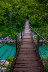 Fototapeta na wymiar wooden bridge over soca river in Slovenia