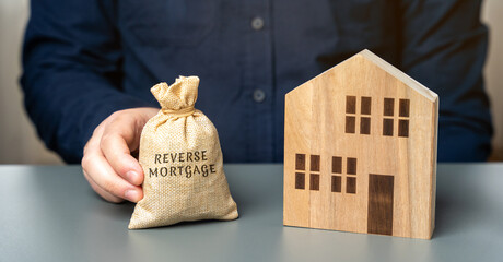 Reverse mortgage concept. Allowing homeowners to borrow money by using their home as collateral for...