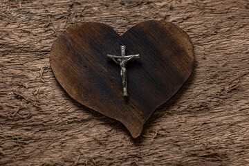Symbols of Catholicism: Cross and wooden heart