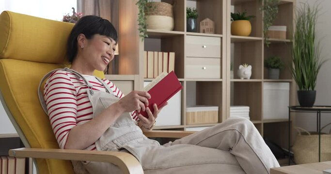 one female mature japanese woman read book at home