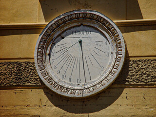 sundial clock on the wall - obrazy, fototapety, plakaty
