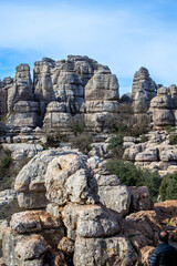 Fototapeta na wymiar Hiking in the Torcal de Antequerra National Park, limestone rock formations and known for unusual karst landforms in Andalusia, Malaga, Spain.