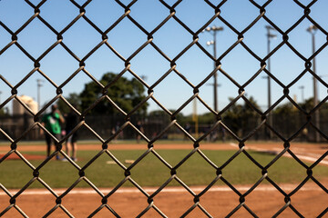 Focus on the fences with background Baseball field out of focus
