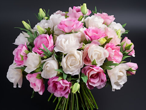 Eustoma flowers in pink and white, with green leaves, form a charming bouquet