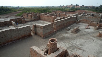 Overhead view of an old, deserted brick kiln with partial walls Mohenjo Daro