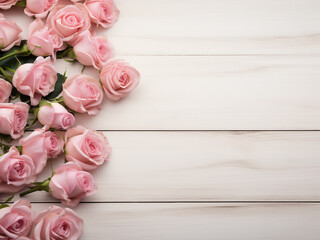 Roses in pink adorn the border on a light wooden background