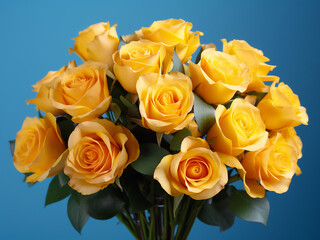 A bouquet of yellow roses stands out against a blue paper background with subtle toning