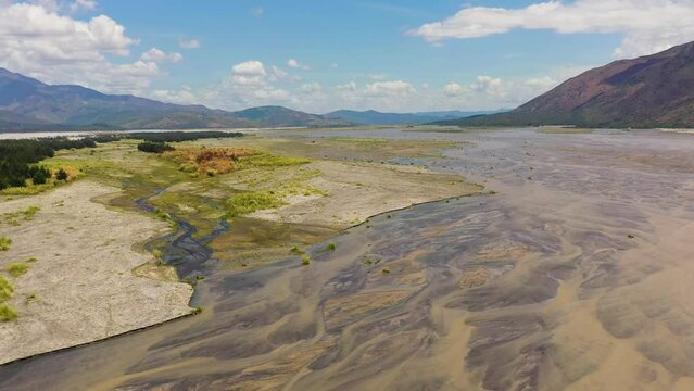 A shallow river bed in a mountain valley. Bucao river. Luzon, Philippines.
