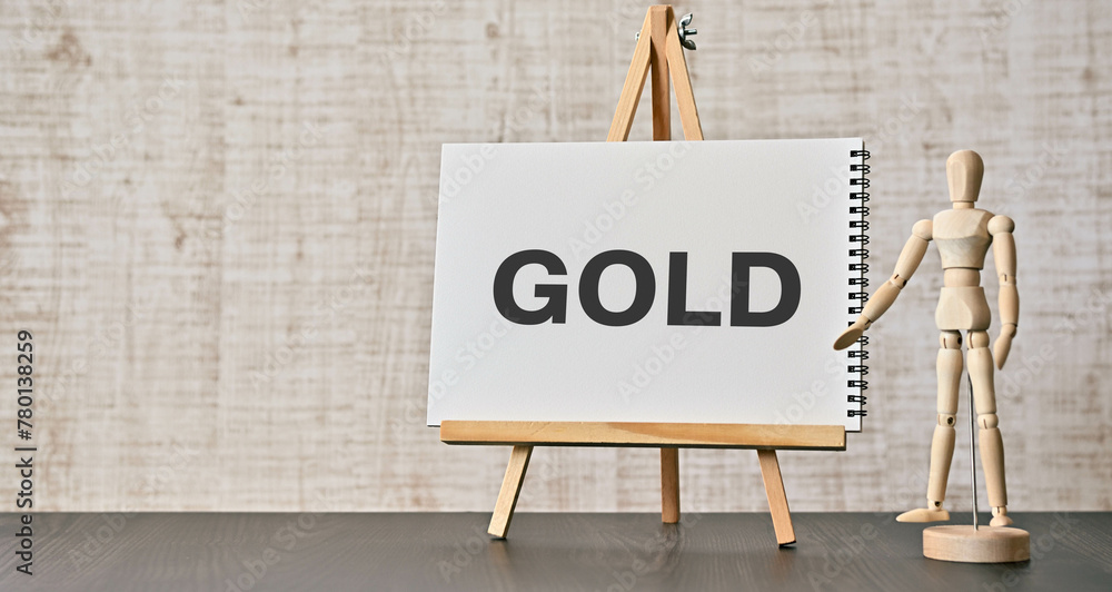 Poster there is notebook with the word gold. it is as an eye-catching image.