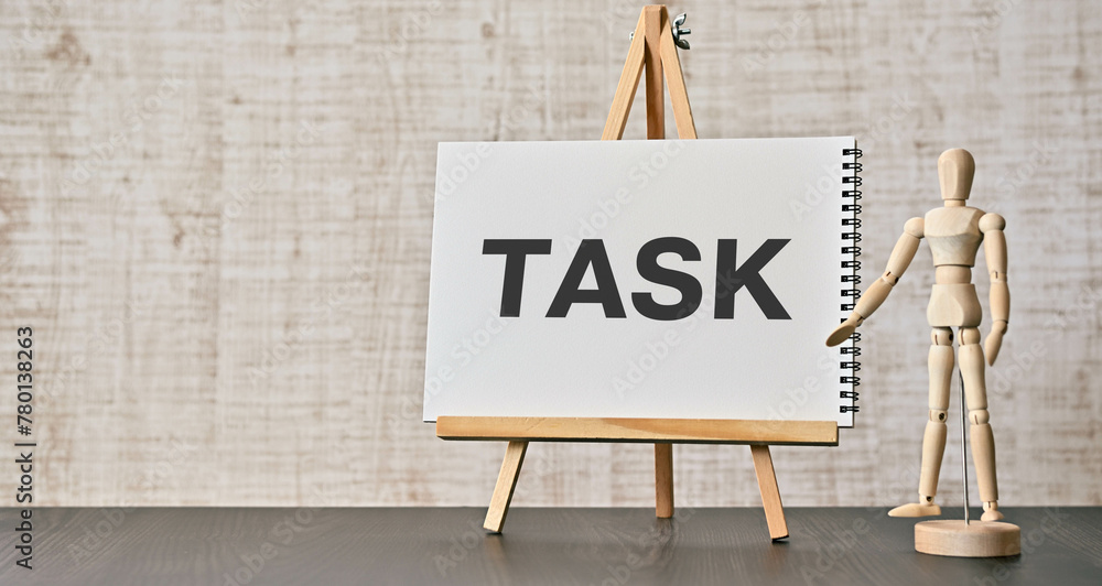 Poster there is notebook with the word task. it is as an eye-catching image.