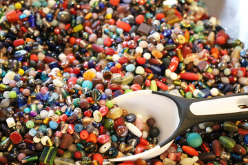 Beads with scoop