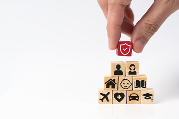 Insurance service concept with shield protection icon on top of various types of insurance icons