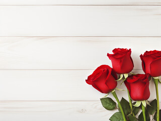 Red roses are arranged in a flat lay on a white wooden background, allowing room for text