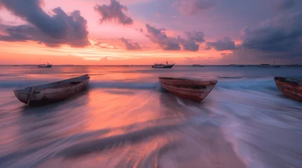 Poster Beautiful sunset at the beach with boats in perspective and ocean waves on a summer evening in Zanzibar, environmental photography, long exposure. The boats were depicted in the style of impressionist © ART-PHOTOS