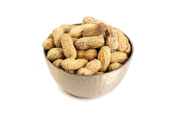A small bowl of roasted peanuts in the shell isolated on white
