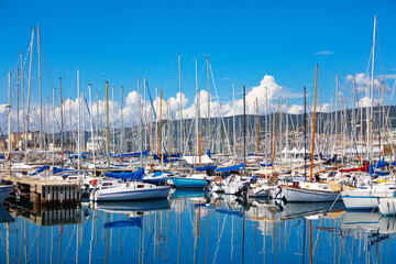 Majestic masts of yachts in the port.  Symbol of adventure and luxury sailing 