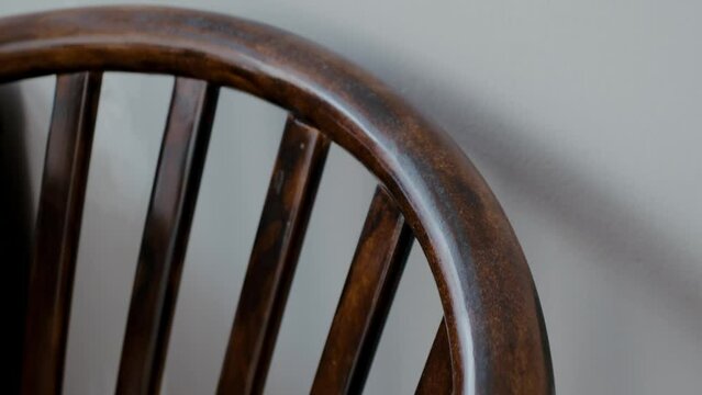 Restoration of a wooden chair. Covering with dark varnish. Close-up. Vintage things. High quality 4k footage