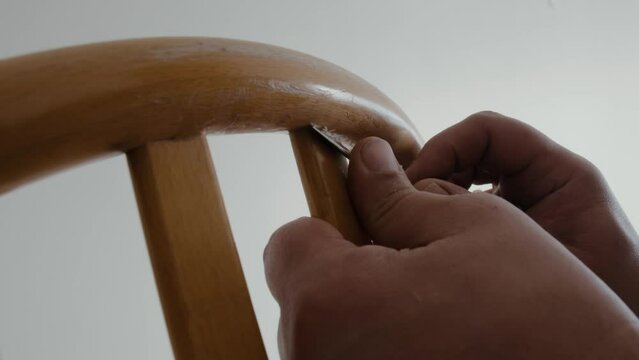 Restoration of a wooden chair. Close-up. Vintage things. High quality 4k footage