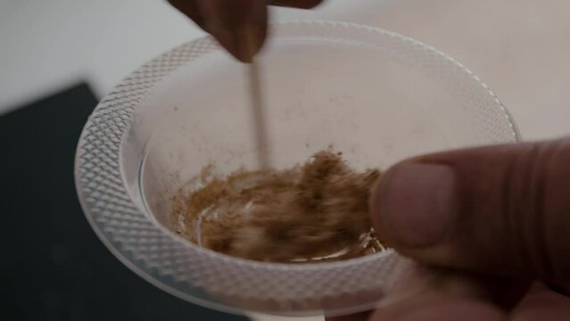 Mixing glue with wood to restore a wooden chair. Close-up. Vintage things. . High quality 4k footage