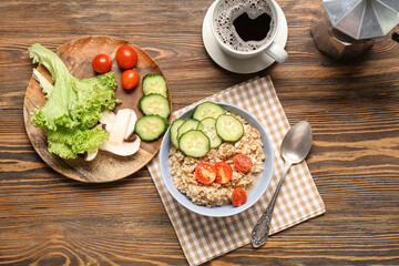 Tasty breakfast with vegetables on wooden background