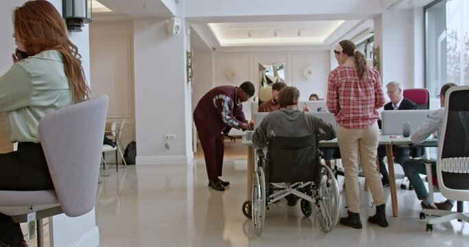 Cross-generational colleagues engage in a business meeting with a focus on collaboration and inclusivity, leveraging their diverse experiences and perspectives for innovative solutions.