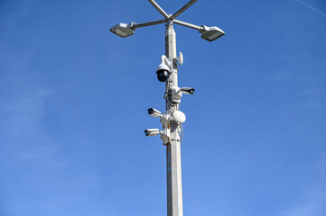 CCTV cameras on the pole. A lot of professional Security cameras scanning the street. Recording video. Concept of surveillance, privacy, criminal, spy, protection and safety.