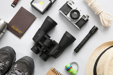 Composition with travel items and passport on white background