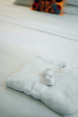 Fototapeta na wymiar white bathrobe on the bed