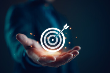 businessman holding target icon Business Growth and Vision, target Plans and Business Strategies and Competitive Advantage, Banking and Finance, Goal Achievement The path to success.