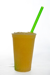 Panoramic still life of ice cream slush frozen colorful frozen fruit granita drinks flowing into takeaway plastic cups with ice cream straws flavor