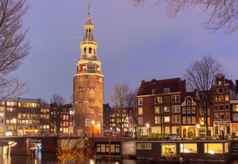 Amsterdam canal Oudeschans and tower Montelbaanstoren, Holland, Netherlands.