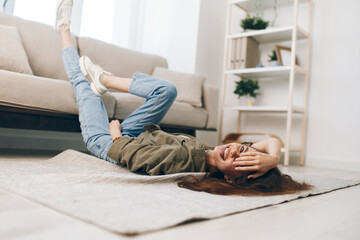 Relaxing on a Cosy Sofa: Happy Woman Enjoying a Peaceful Mental Well-being in a Modern Apartment