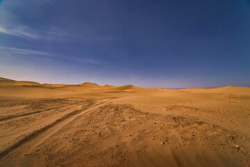 Fototapeta na wymiar A panoramic sand dune of sahara desert at Mhamid el Ghizlane in Morocco wide shot