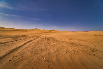 Fototapeta na wymiar A panoramic sand dune of sahara desert at Mhamid el Ghizlane in Morocco wide shot