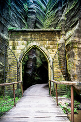 Fototapeta na wymiar Wooden Walkway Leading to Tunnel in Adrspach Teplice Rock Formation