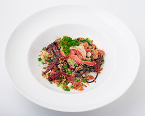 Black pasta stir fried chilli with shrimp topped with parsley, dried chilli, sliced spring onion, fried garlic, and cheese. Black spaghetti made from the ink in the squid.