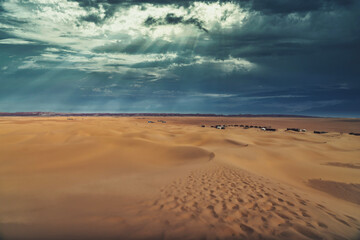 Fototapeta na wymiar A panoramic sand dune near the desert camp at Mhamid el Ghizlane in Morocco