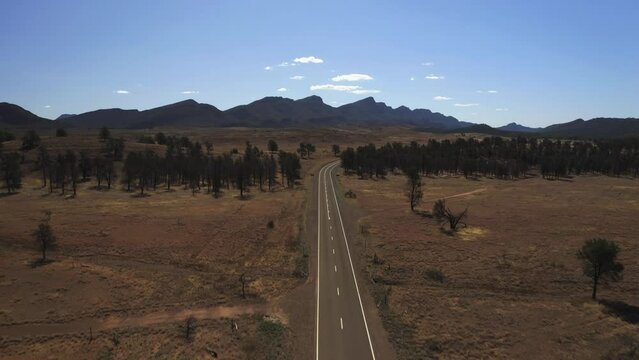 Aerial drone view of the vast land of Flinders Ranges, South Australia.
Surrounded by ancient mountain ranges, spectacular gorges and sheltered creeks, is one of the wildest destinations in Australia.