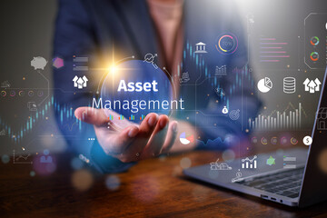 Asset management concept, Businessman Holding asset management and Icon  on virtual display. Financial Property Digital assets.